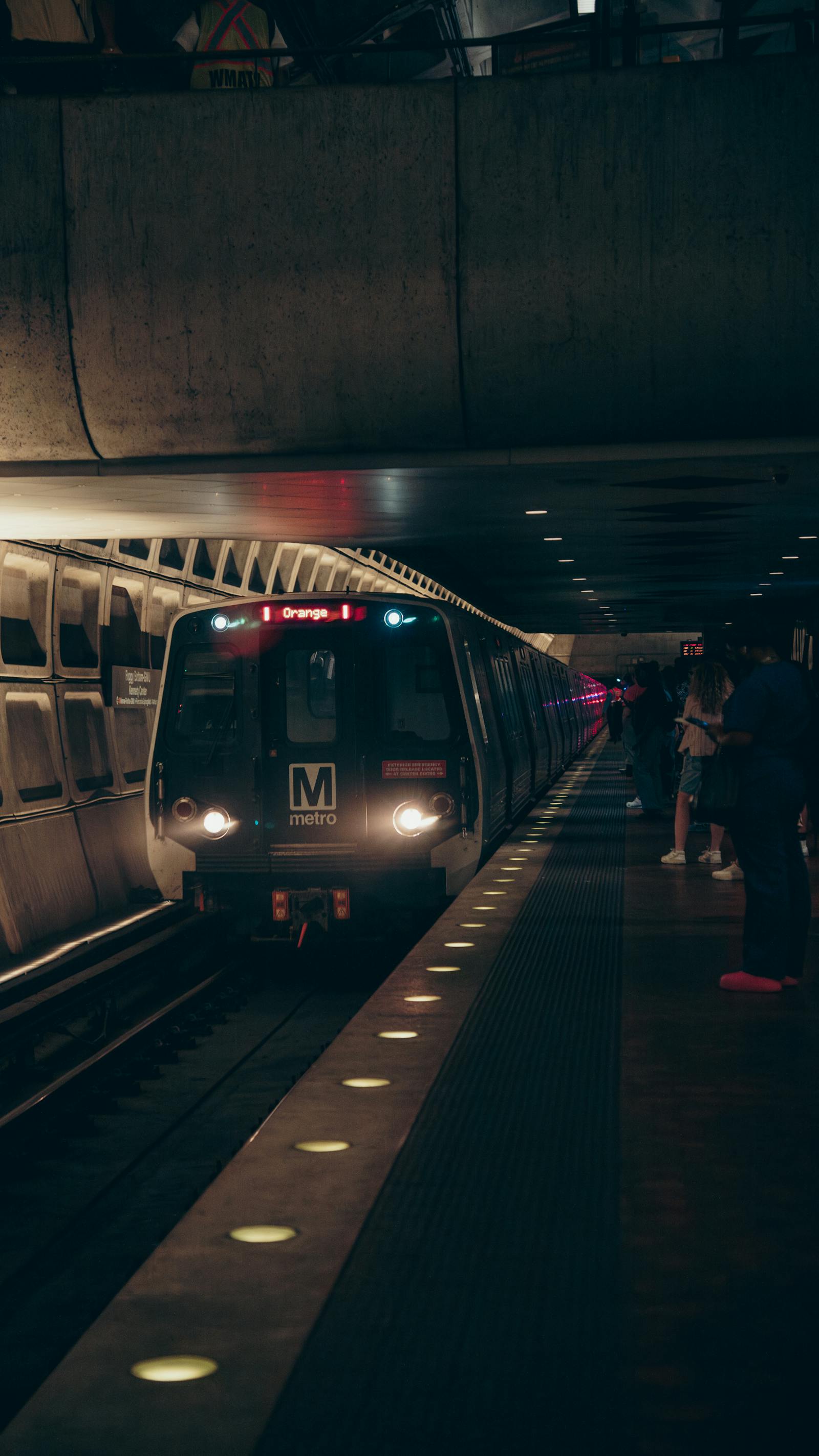 Washington DC Metro train arriving at an underground station platform