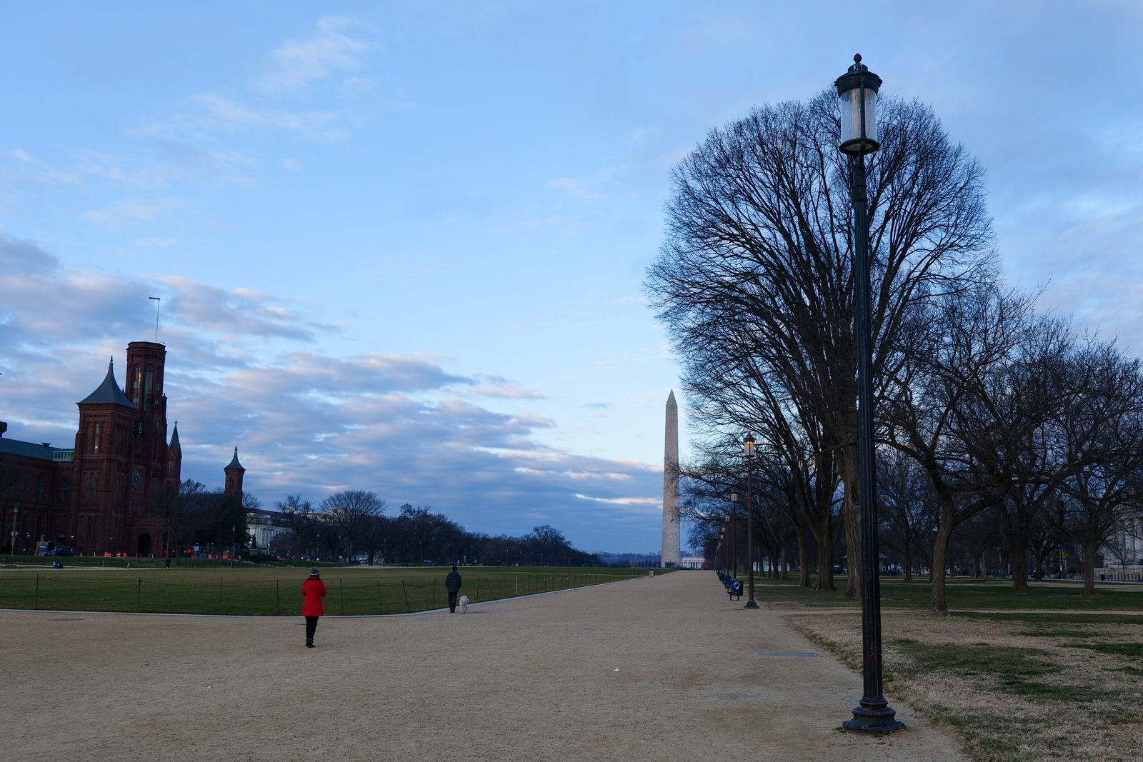 National Mall, Smithsonian Castle, and Washington Monument at dawn in Washington DC